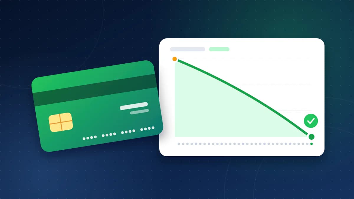 A green credit card in front of a chart where a balance line falls month by month to zero and ends in a green check mark